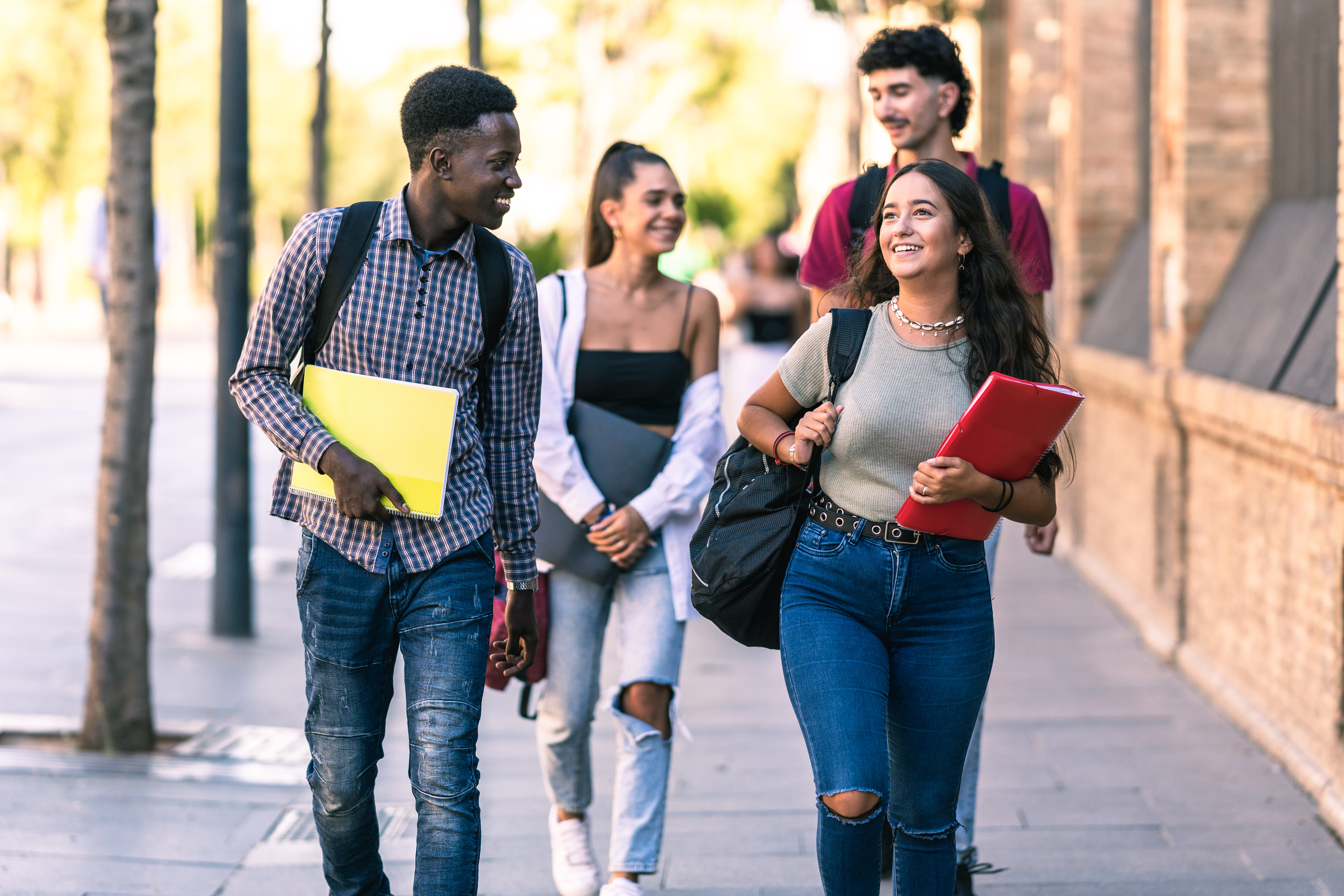 4 students walking together 