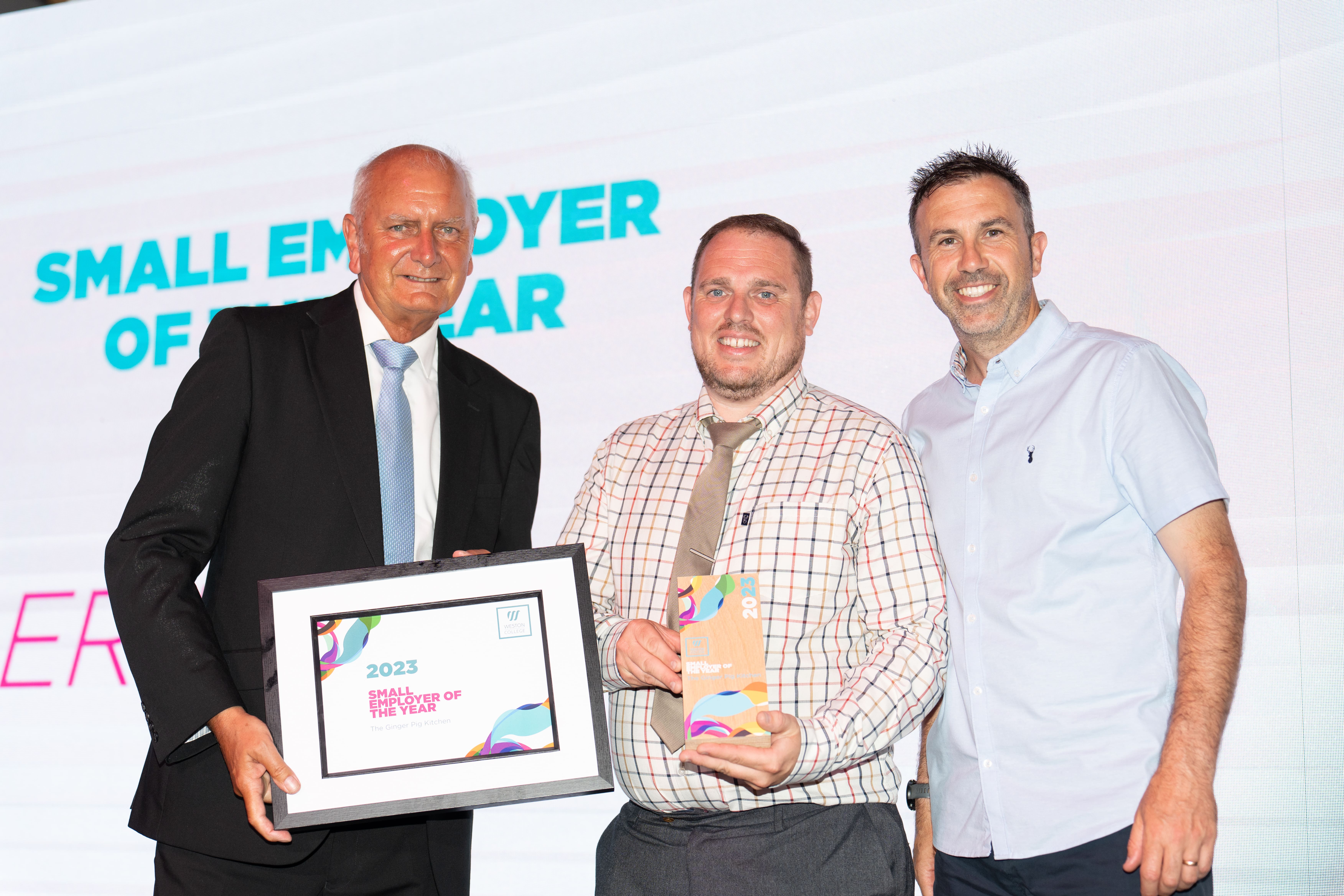 The Ginger Pig Kitchen, on stage holding thier award next to Andy Lewis