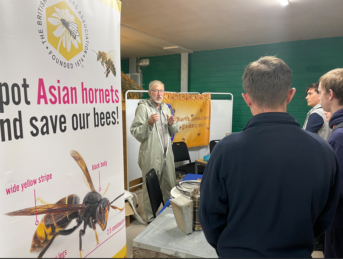 Students standing listening to the talks