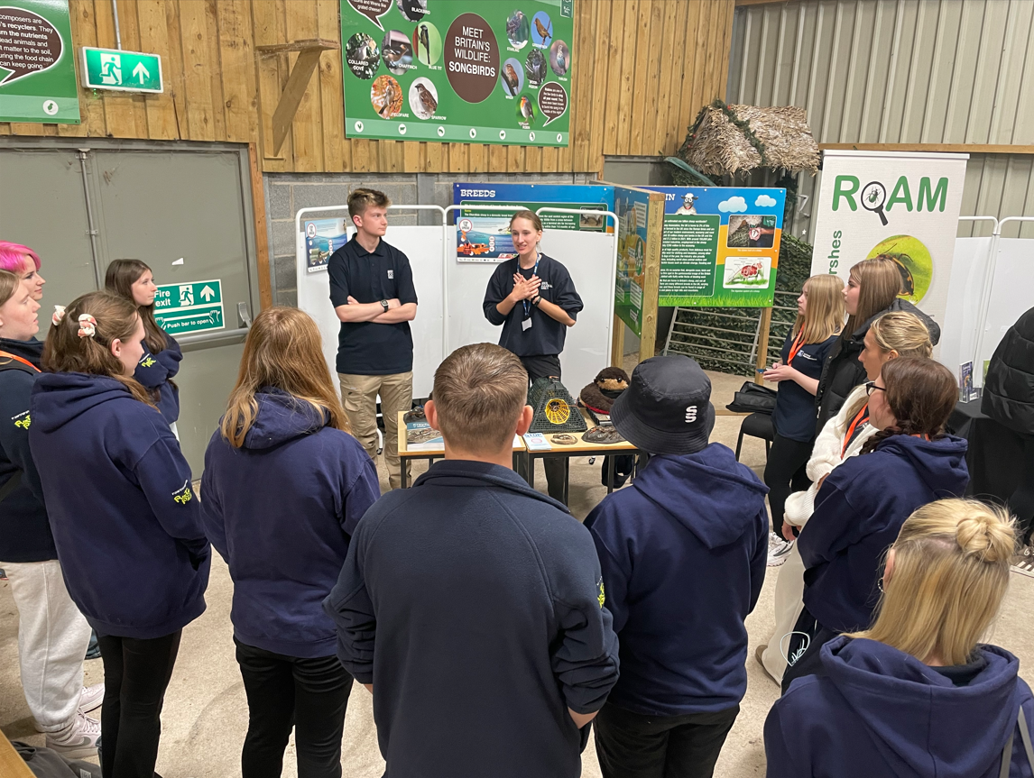 Students standing listening to the talks