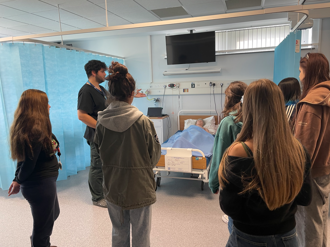 Health & Social Care students being introduced to the SIM room