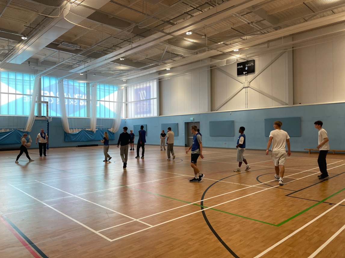 Sport students playing basketball