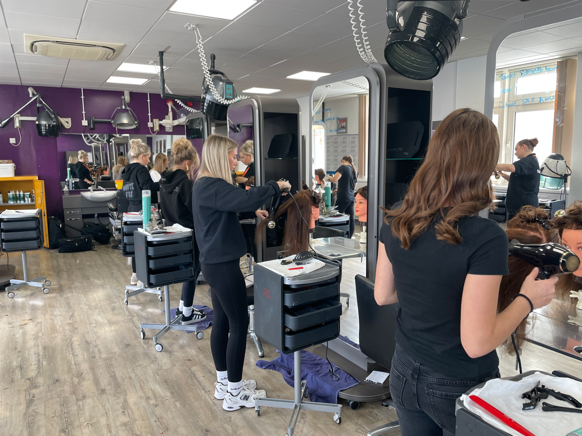 Hairdressing students doing a blowout