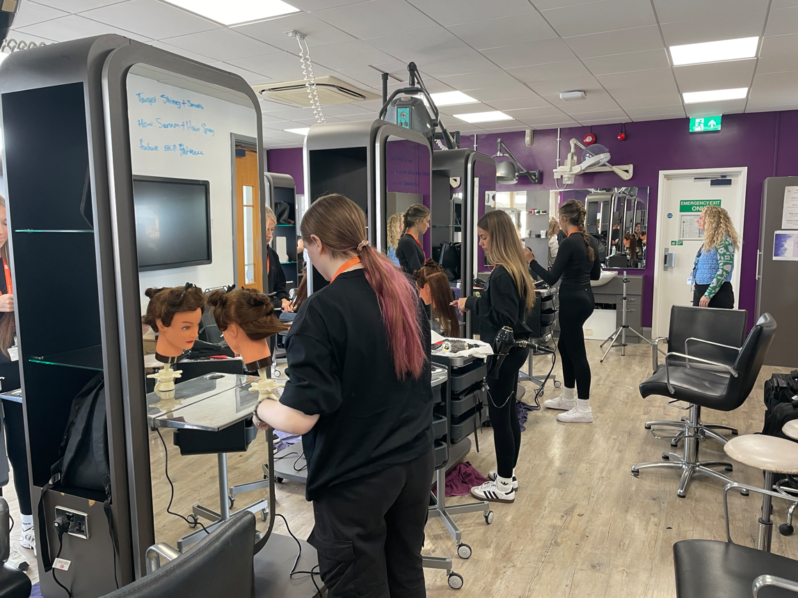 Hairdressing students doing a blowout