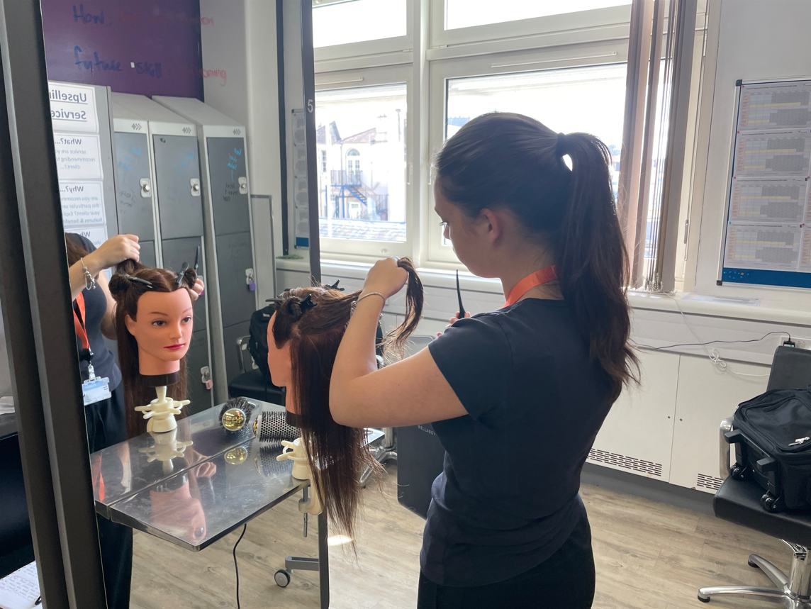 Hairdressing students doing a blowout