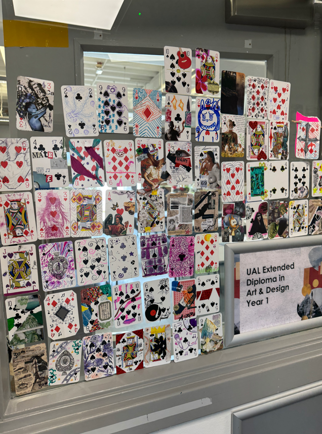 Art & Design students painting on playing cards