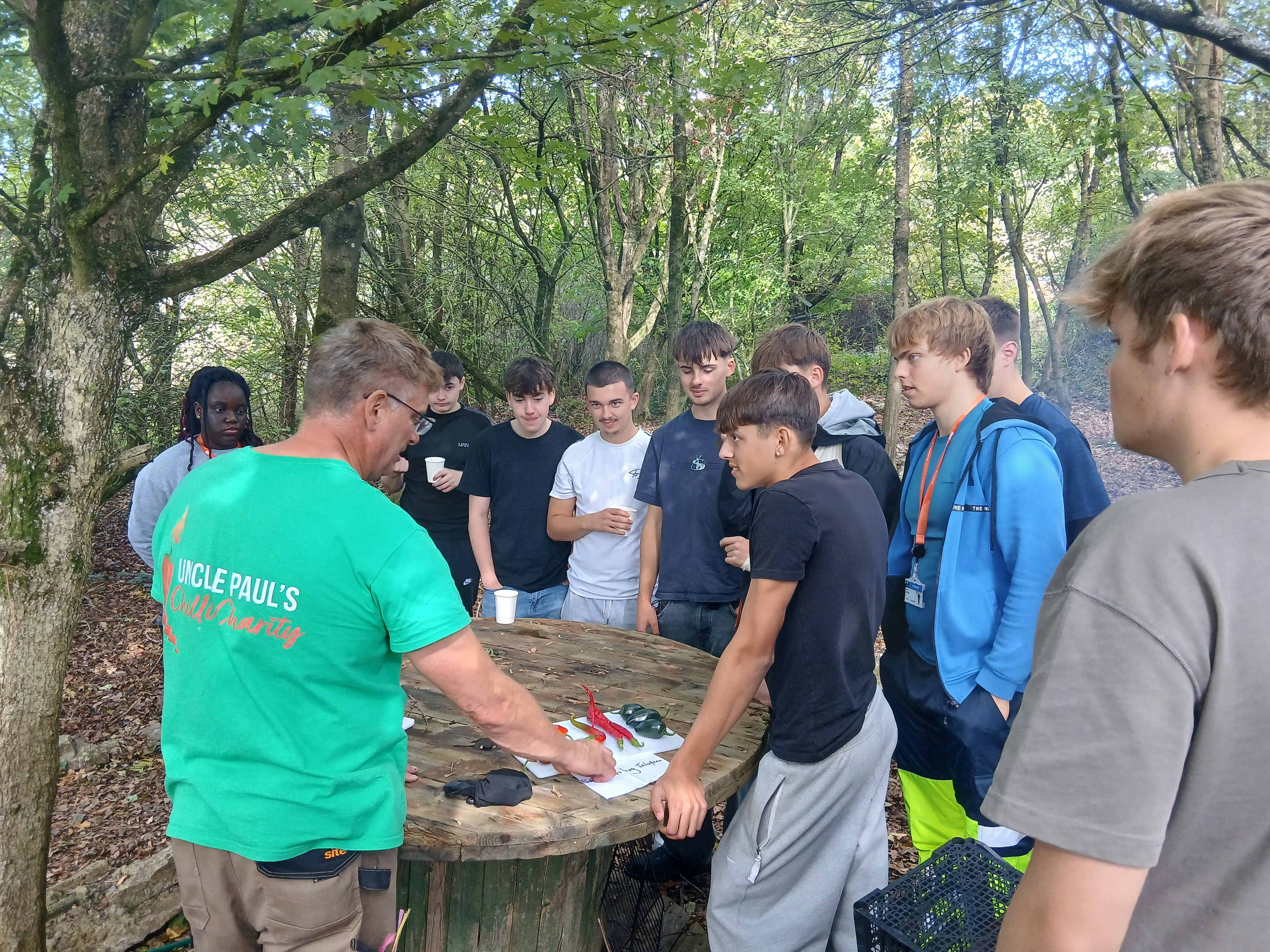 Students hearing about chilli's from a professional at the farm