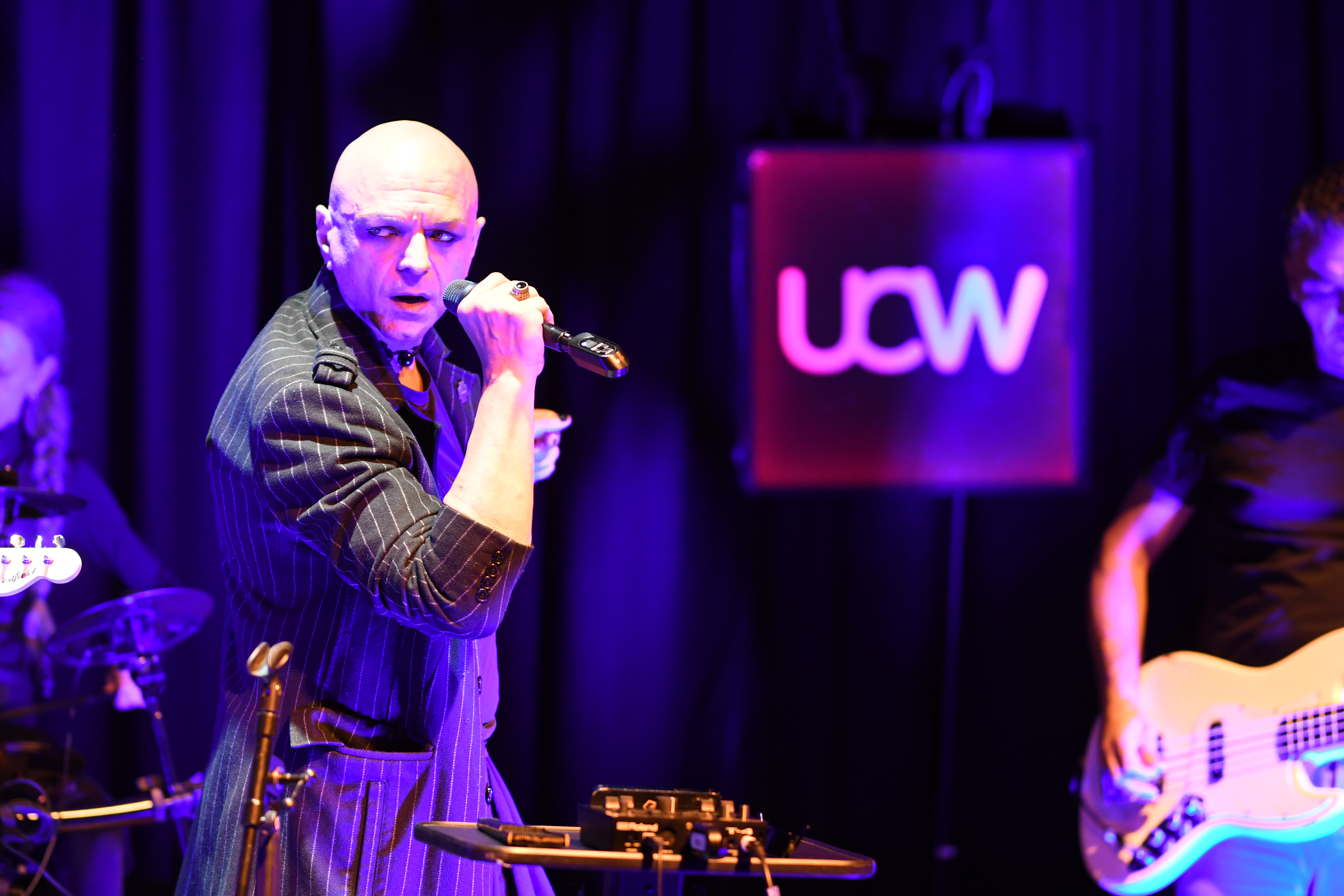 The Peripheries Lead Singer singing on stage