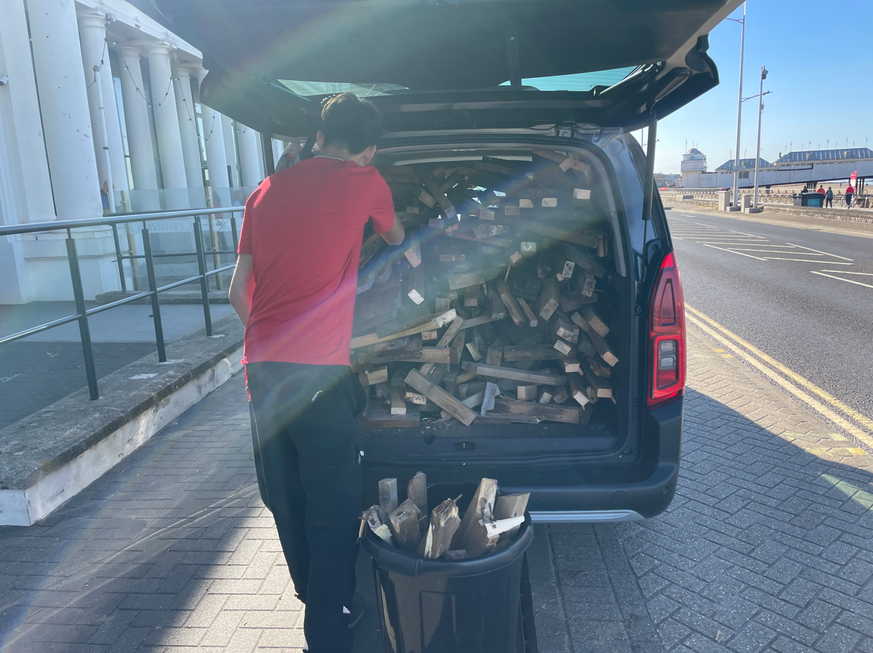 Wood piled in the back of a van