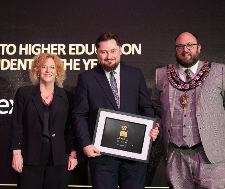 Alex collecting his award at Celebration of Success 2025