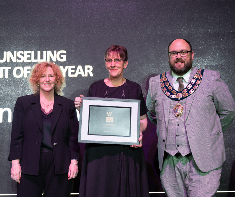 Caroline collecting her award at Celebration of Success 2025