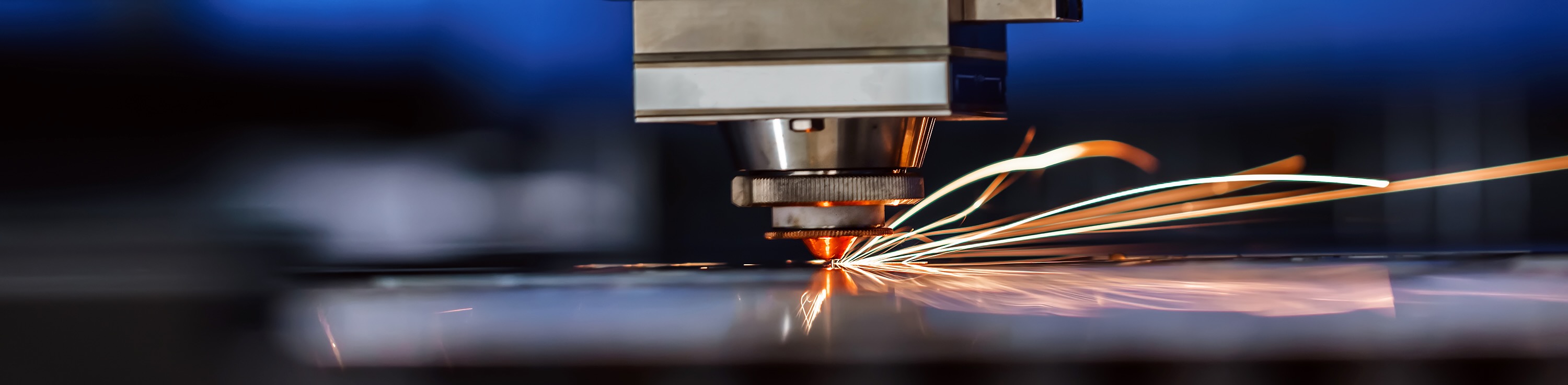 closeup of laser cutter making sparks