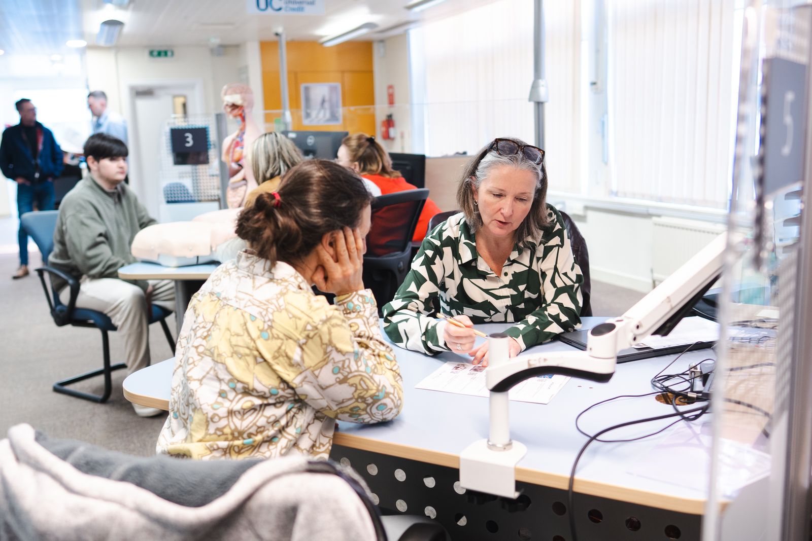 People speaking with Weston College staff