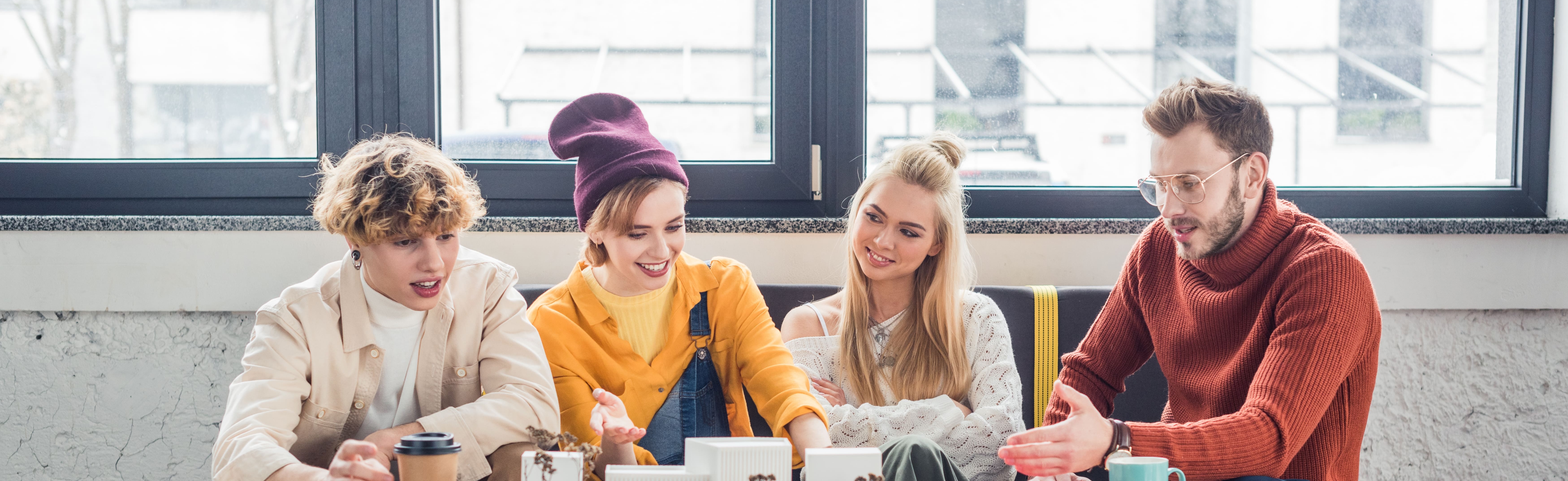 group of cheerful people on a sofa