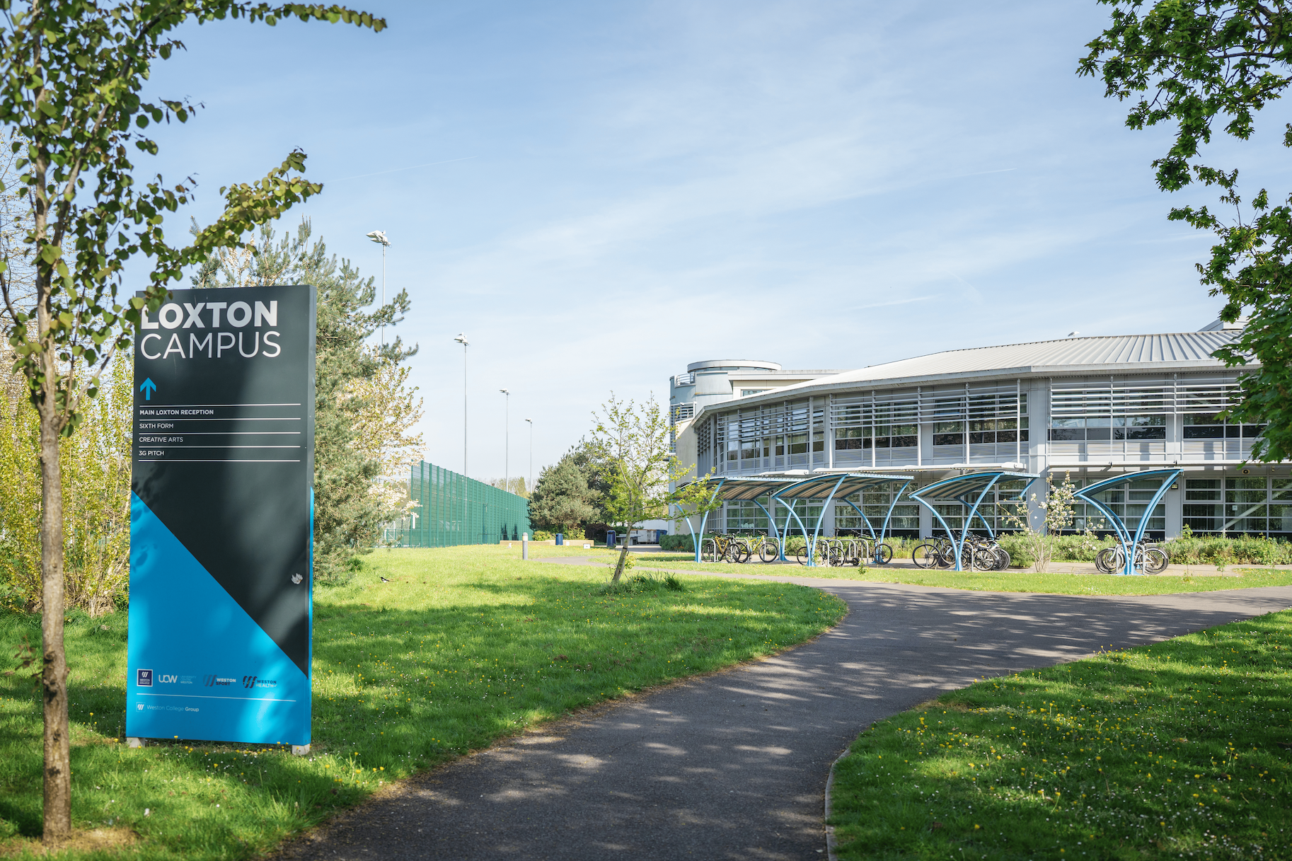 outside of loxton campus, with a location sign in the foreground