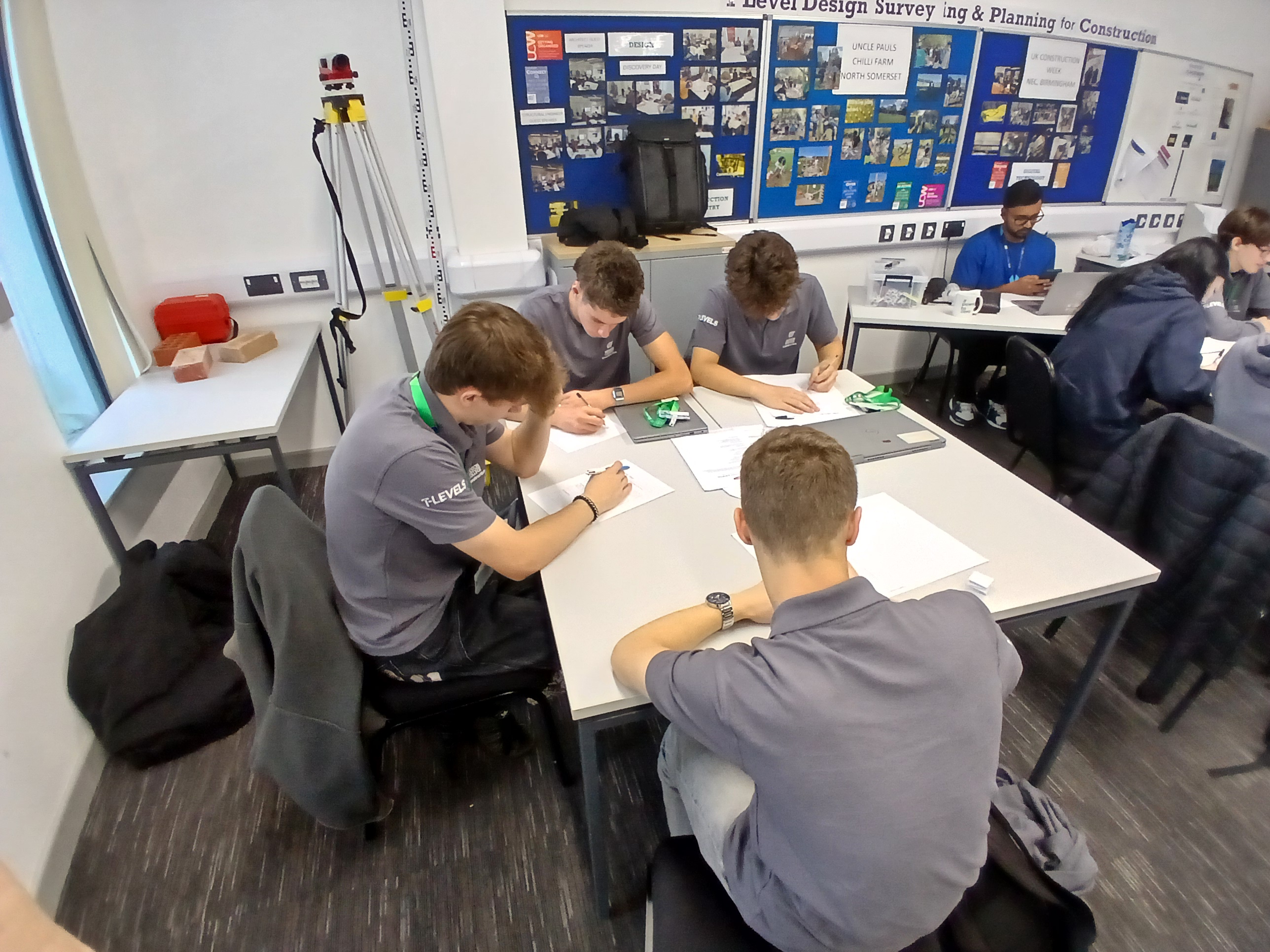 Students sat at tables while writing during CV workshop