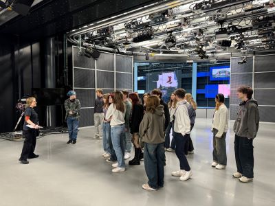 Media students receiving a tour around the bbc news studio