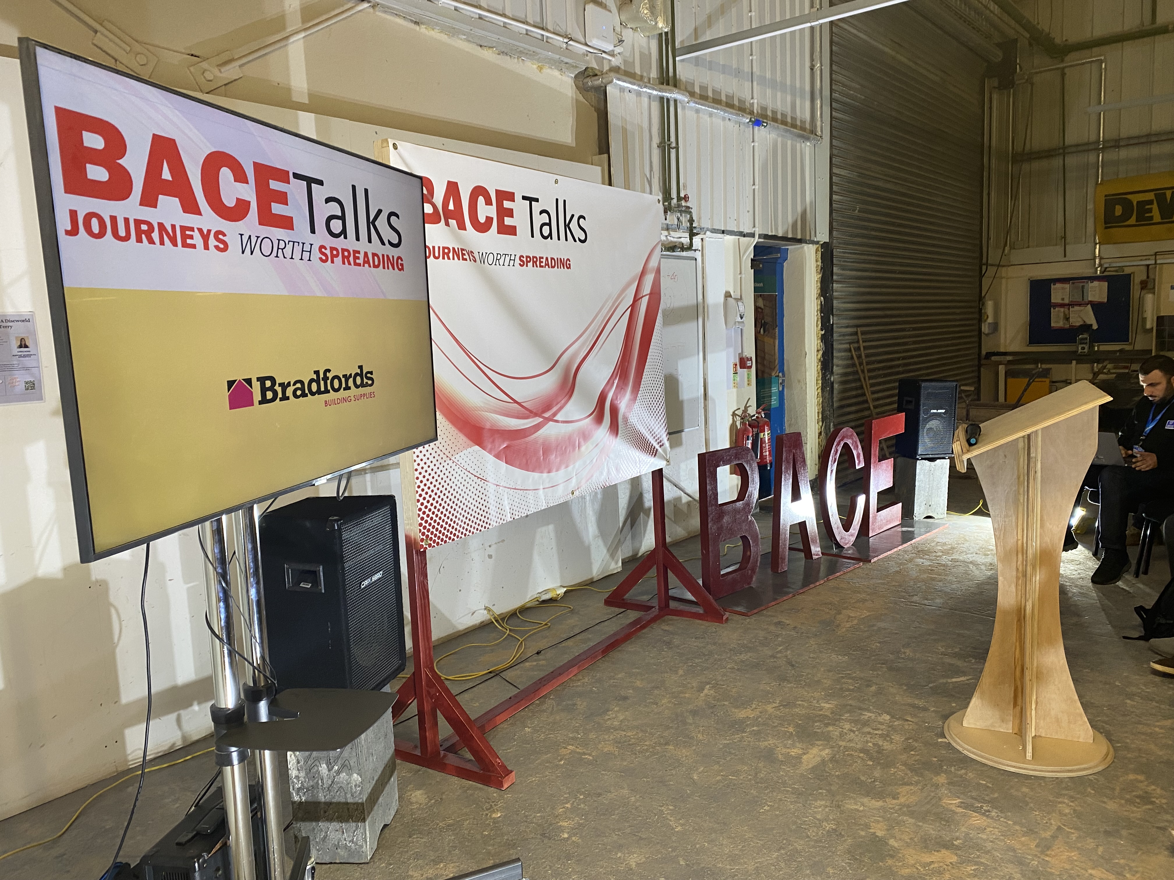 BACE Talks screen in front of BACE Talks background