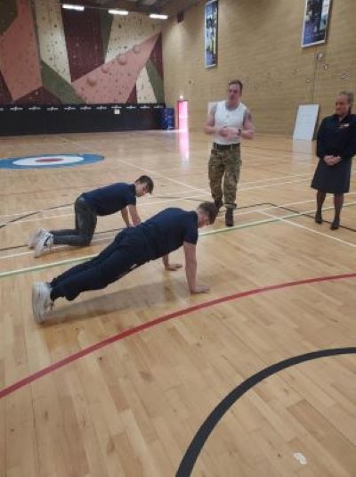 Learners doing push ups in army base gym