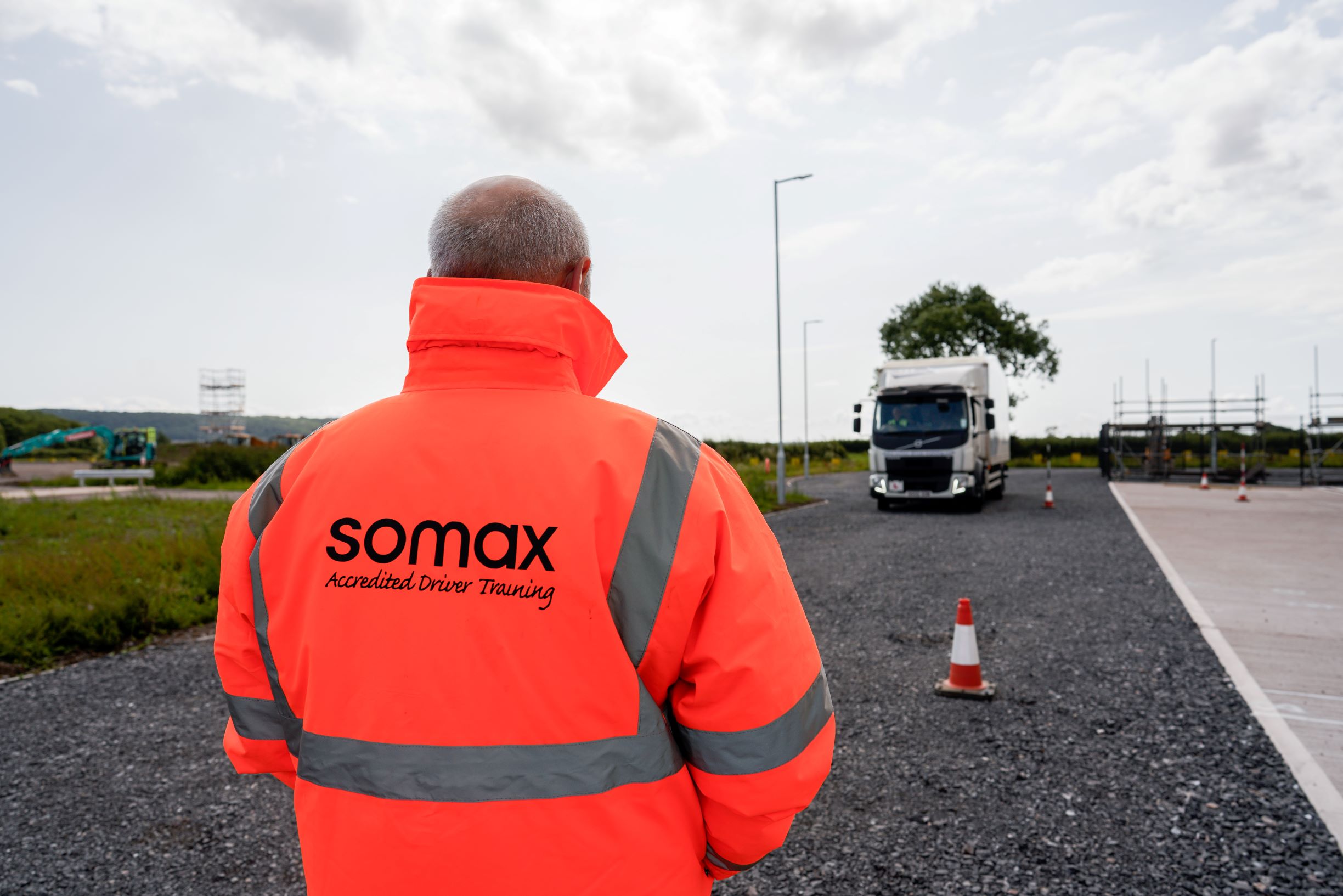 Driver training watching lorry