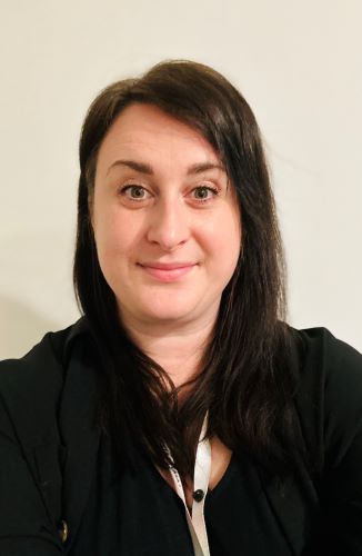 Holly smiling in front of the camera