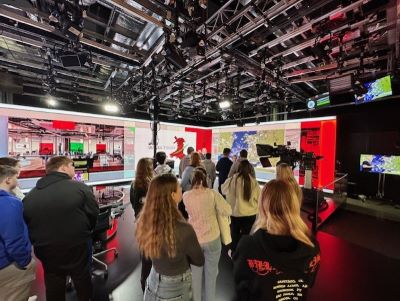 Media students receiving a tour around the bbc news studio