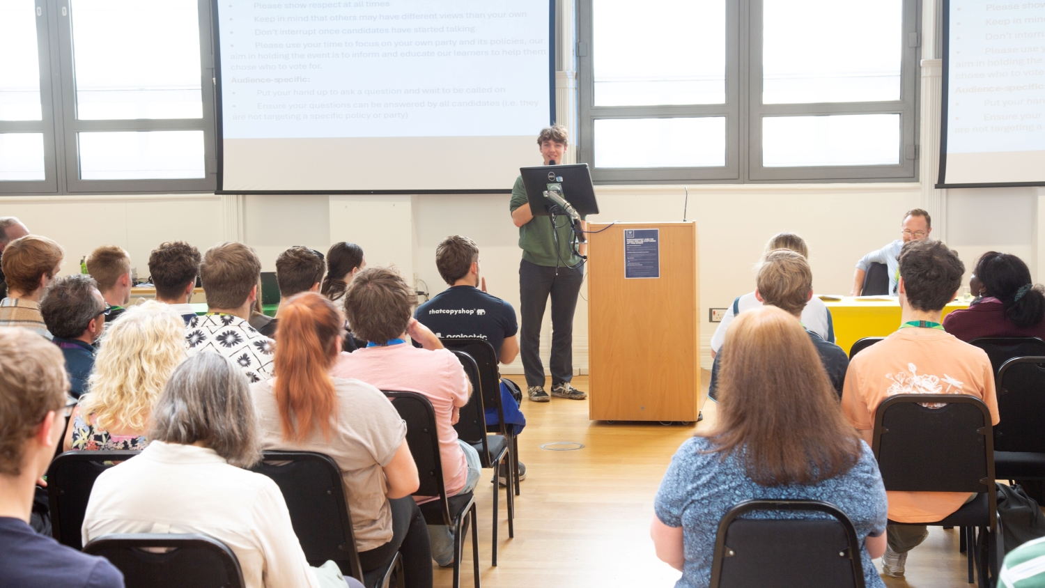 Thomas Green addressing the audience and introducing himself