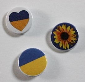 Ukraine badges - one with yellow flower one with Ukraine flag