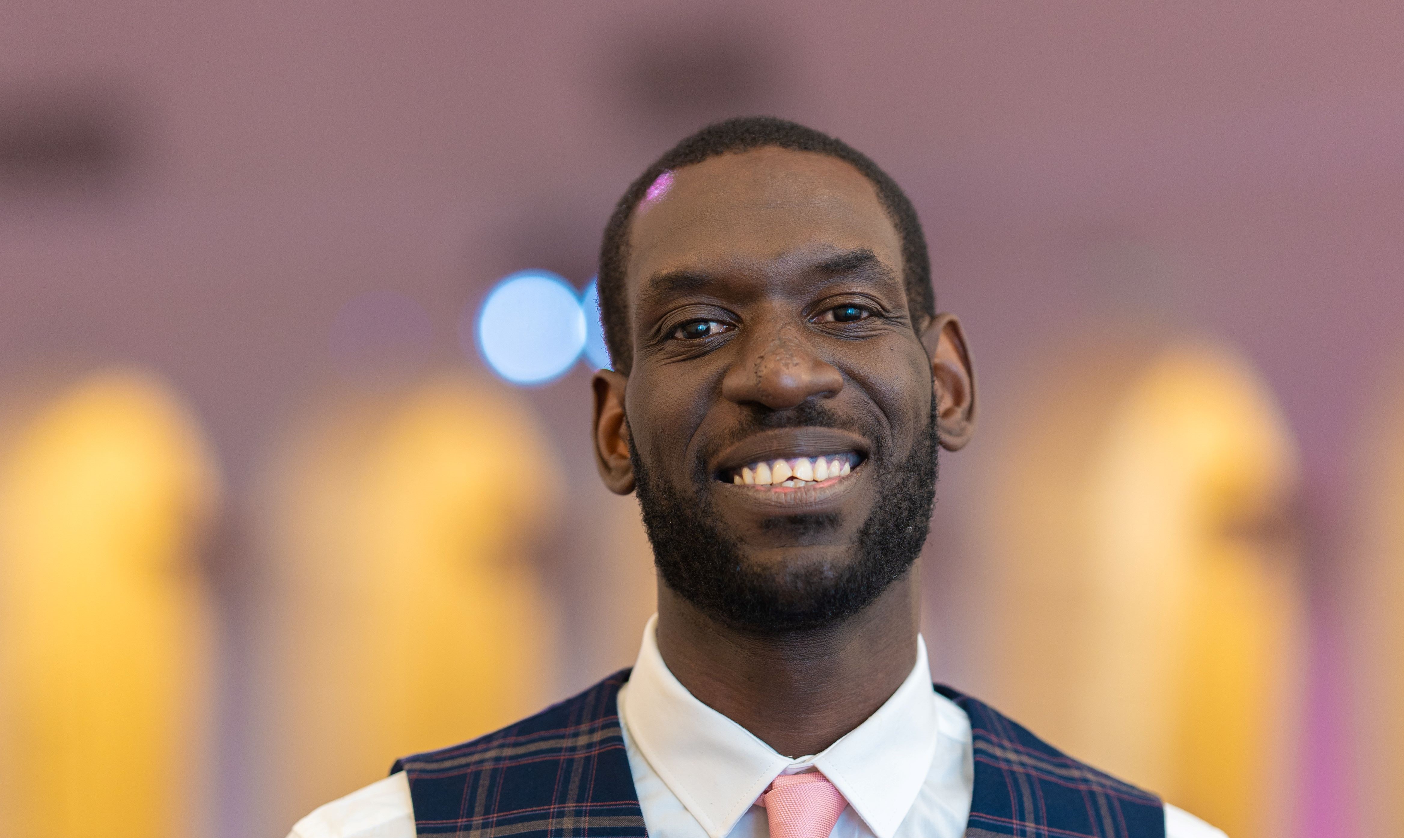 Kam smiling at the camera