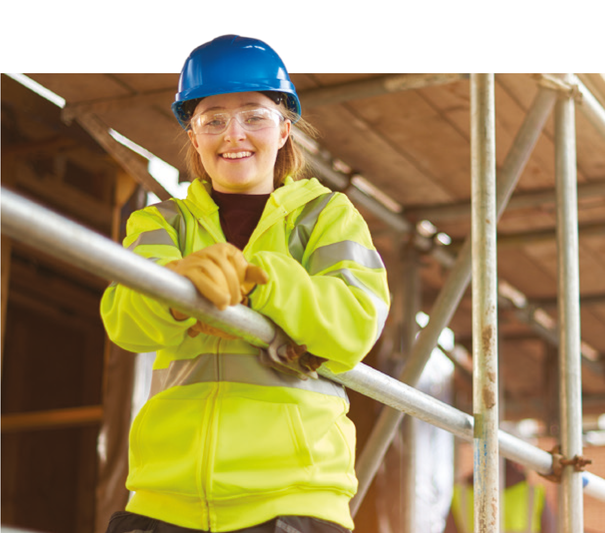 female scaffolding student posing on scaffold