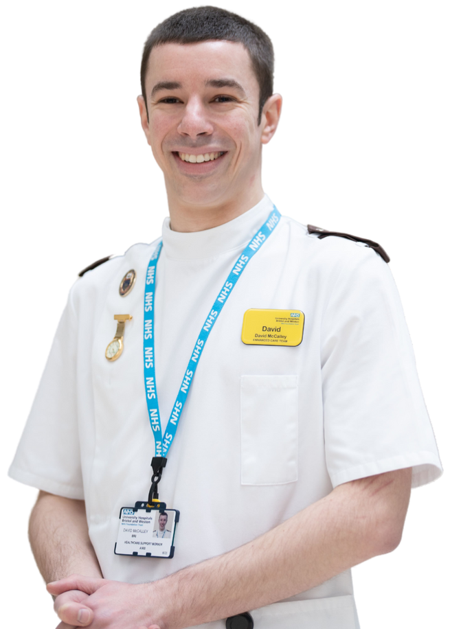 cut out of paramedic apprentice smiling with hands in front of him 