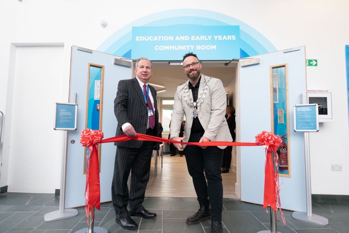Dr paul cuts red ribbon to open new early years facilities 