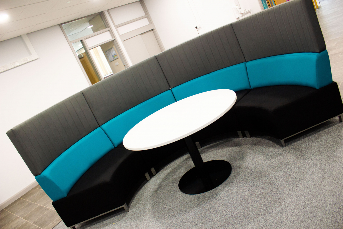 curved seating area in communal room  
