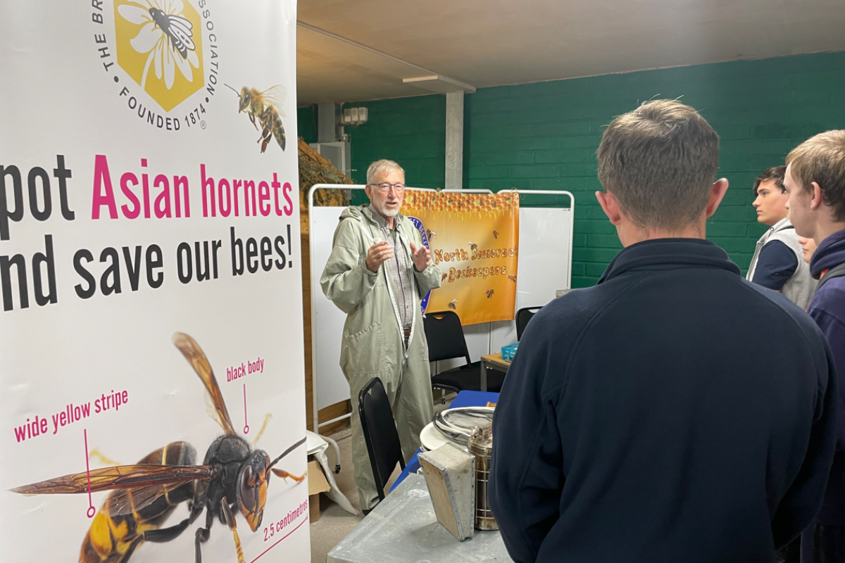 Students standing listening to the talks 