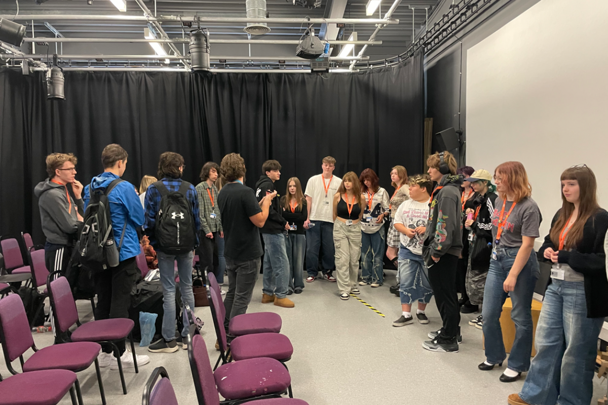 Media students gathered together to discuss a task 