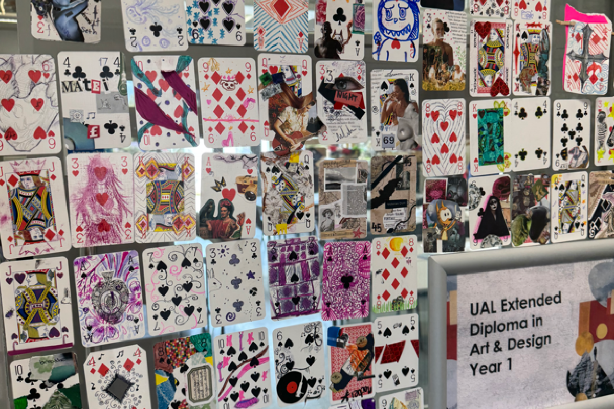 Art & Design students painting on playing cards 