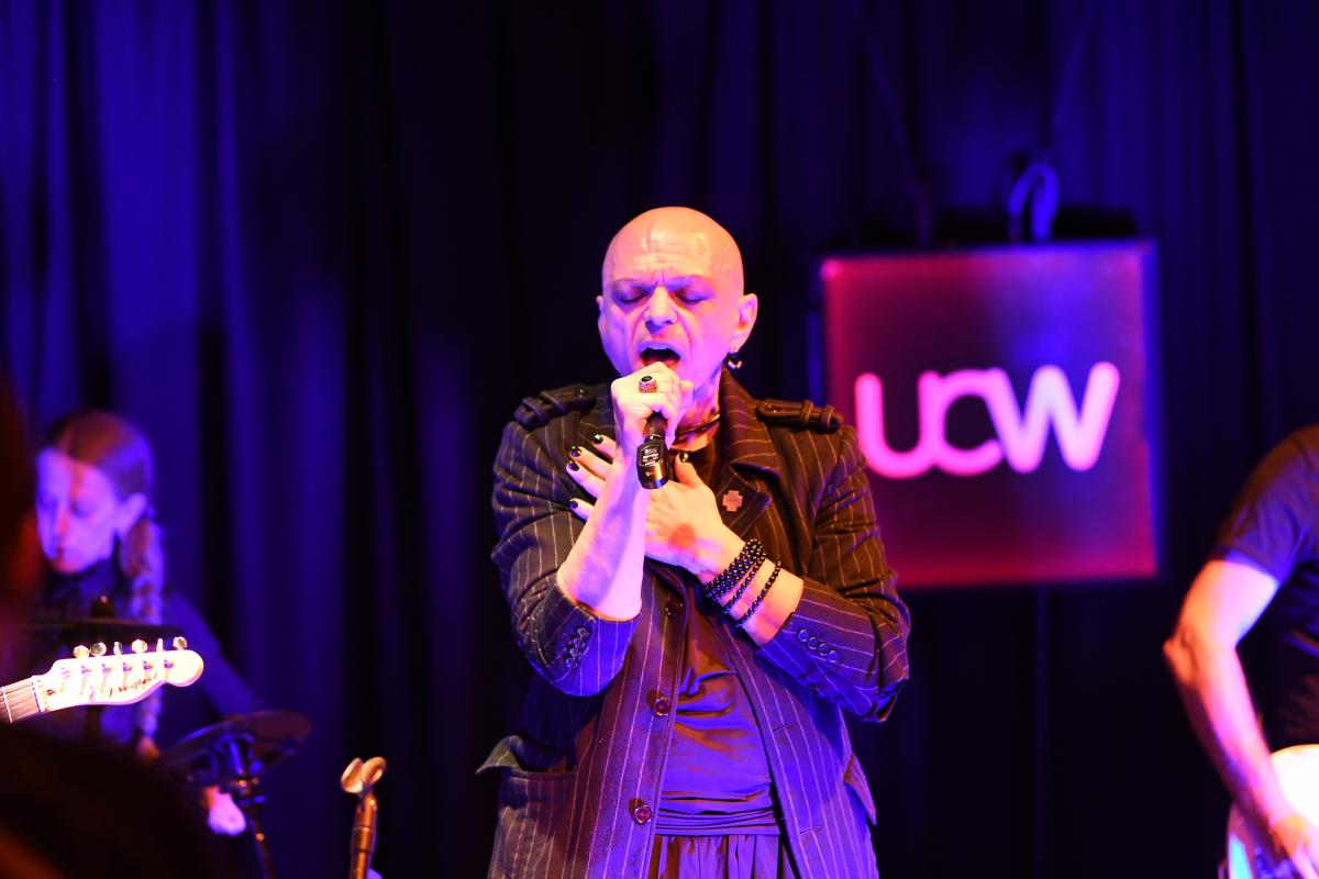 The Peripheries Lead Singer singing on stage