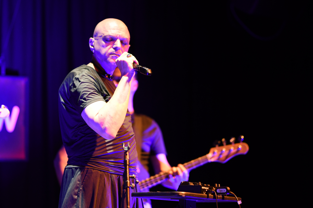 The Peripheries Lead Singer singing on stage