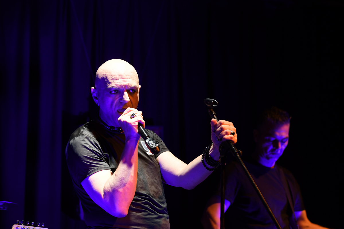 The Peripheries Lead Singer singing on stage 