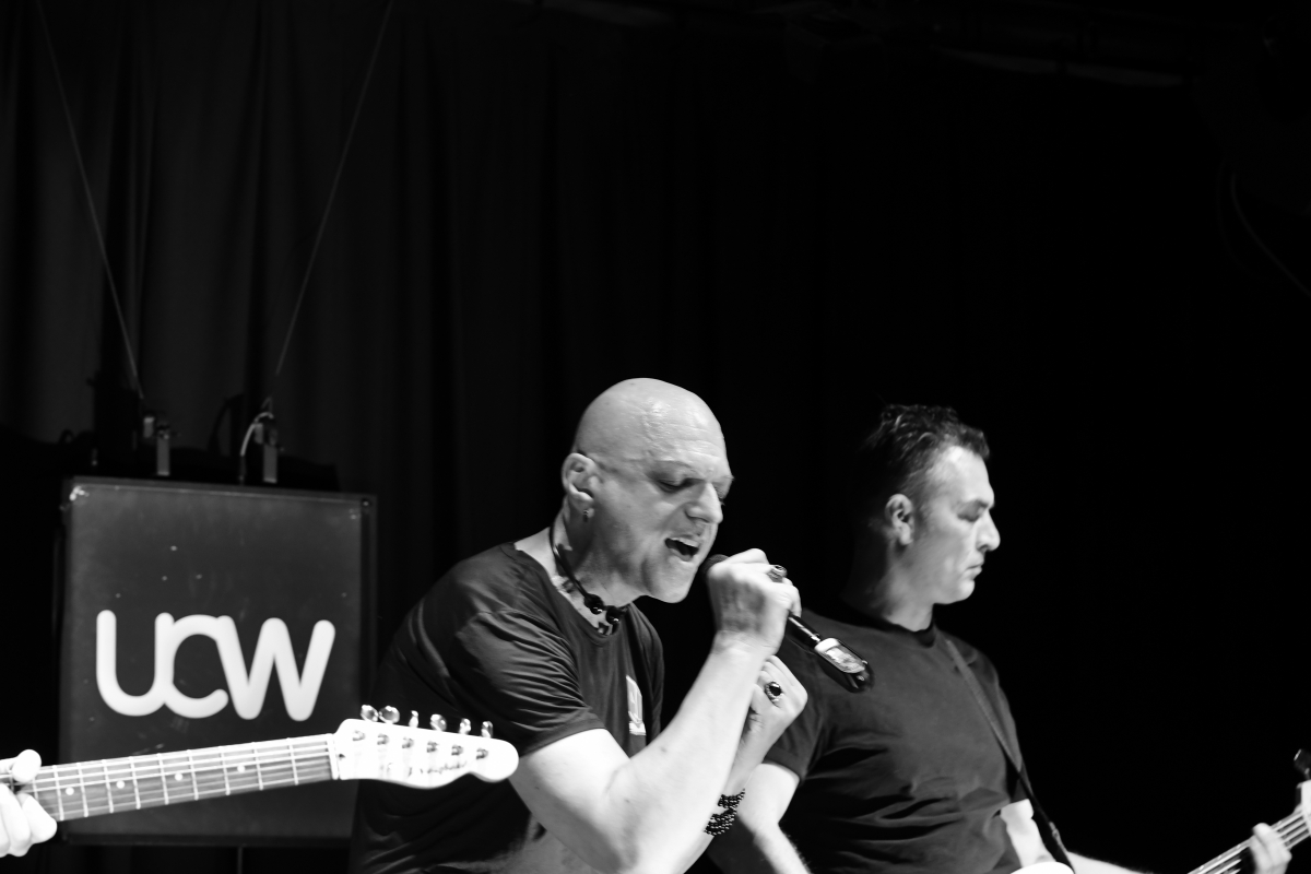 The Peripheries Lead Singer singing on stage 