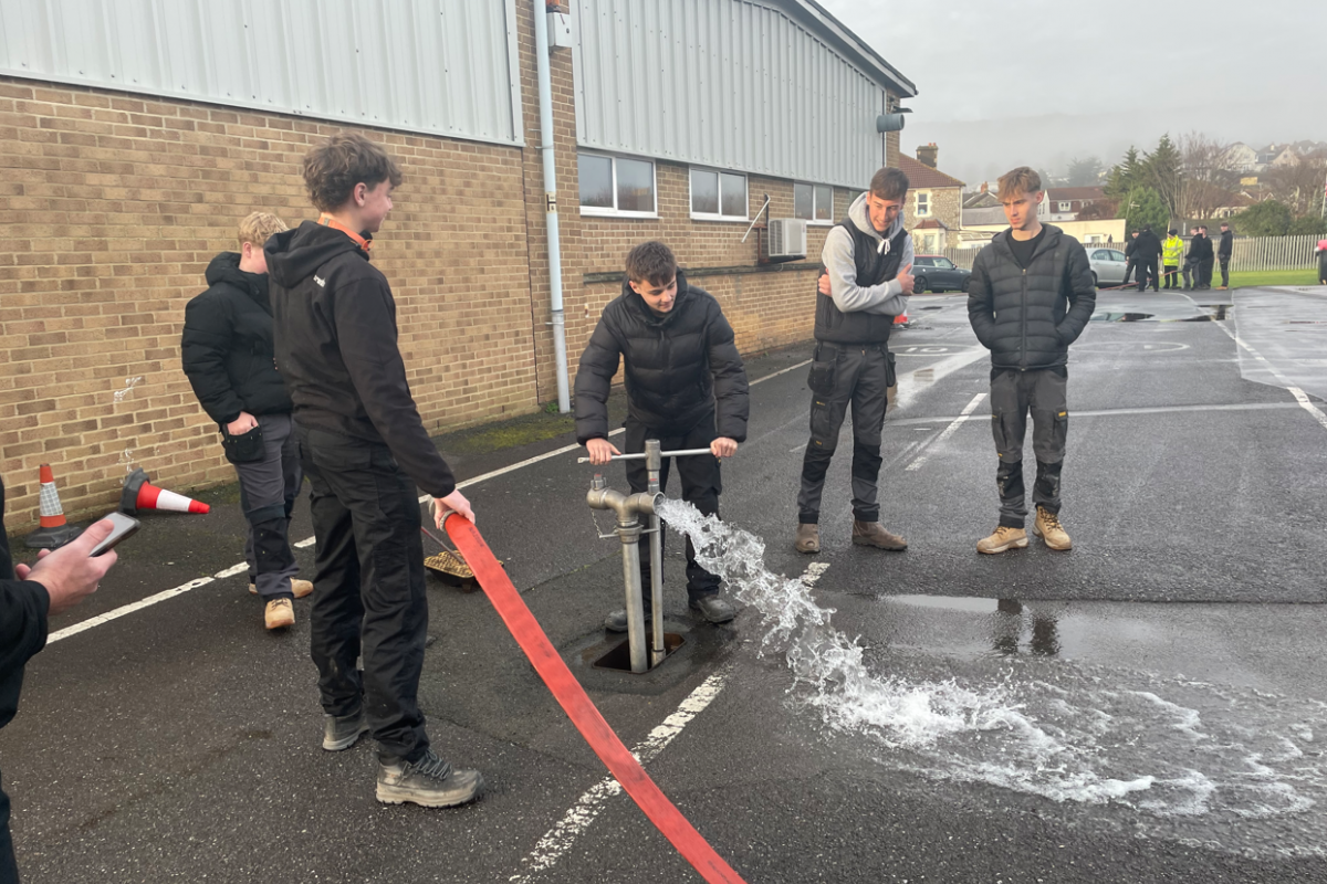 students tapping into fire hydrant water