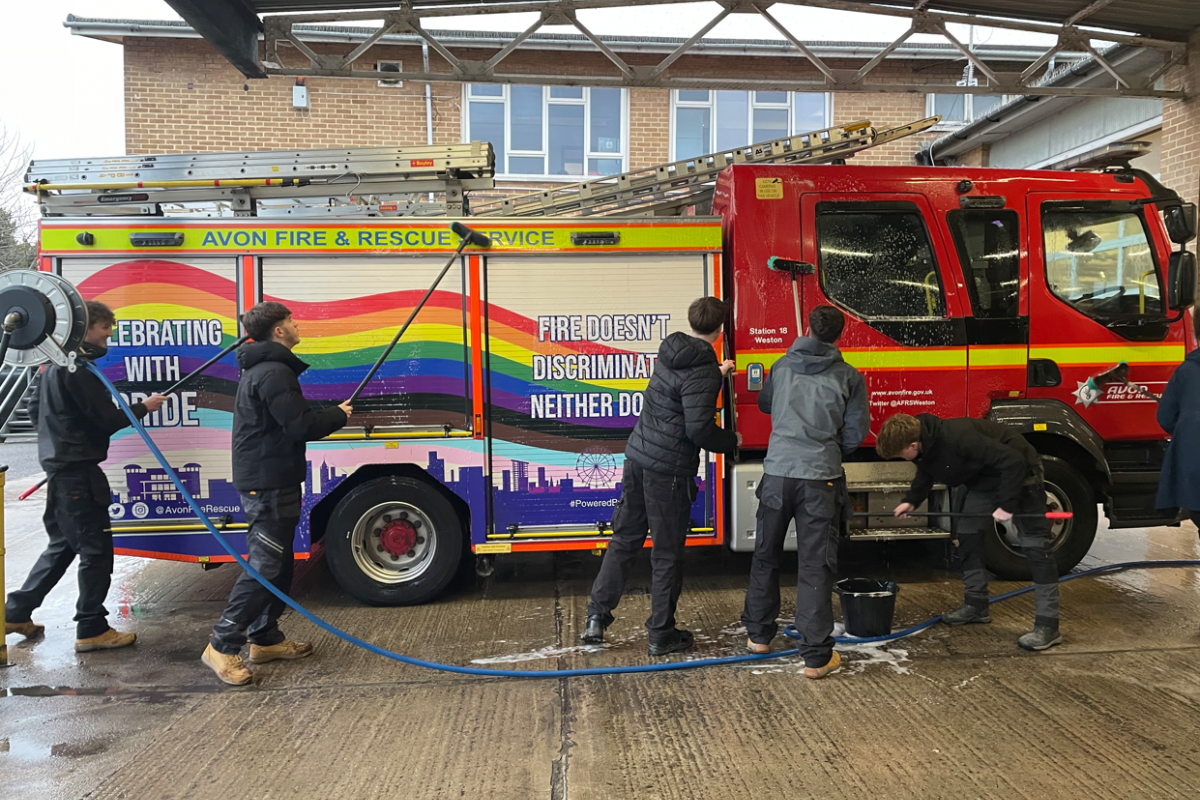 Students cleaning fire engine