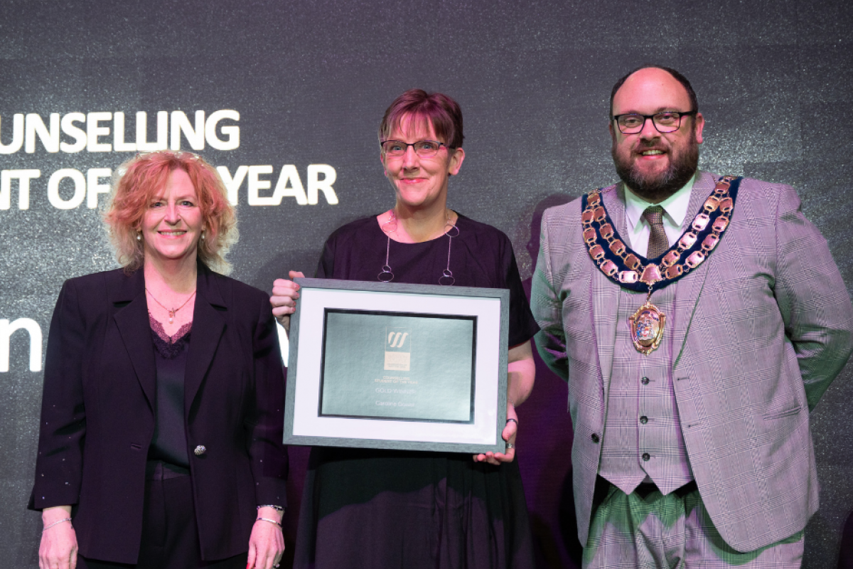 Caroline collecting her award at Celebration of Success 2025