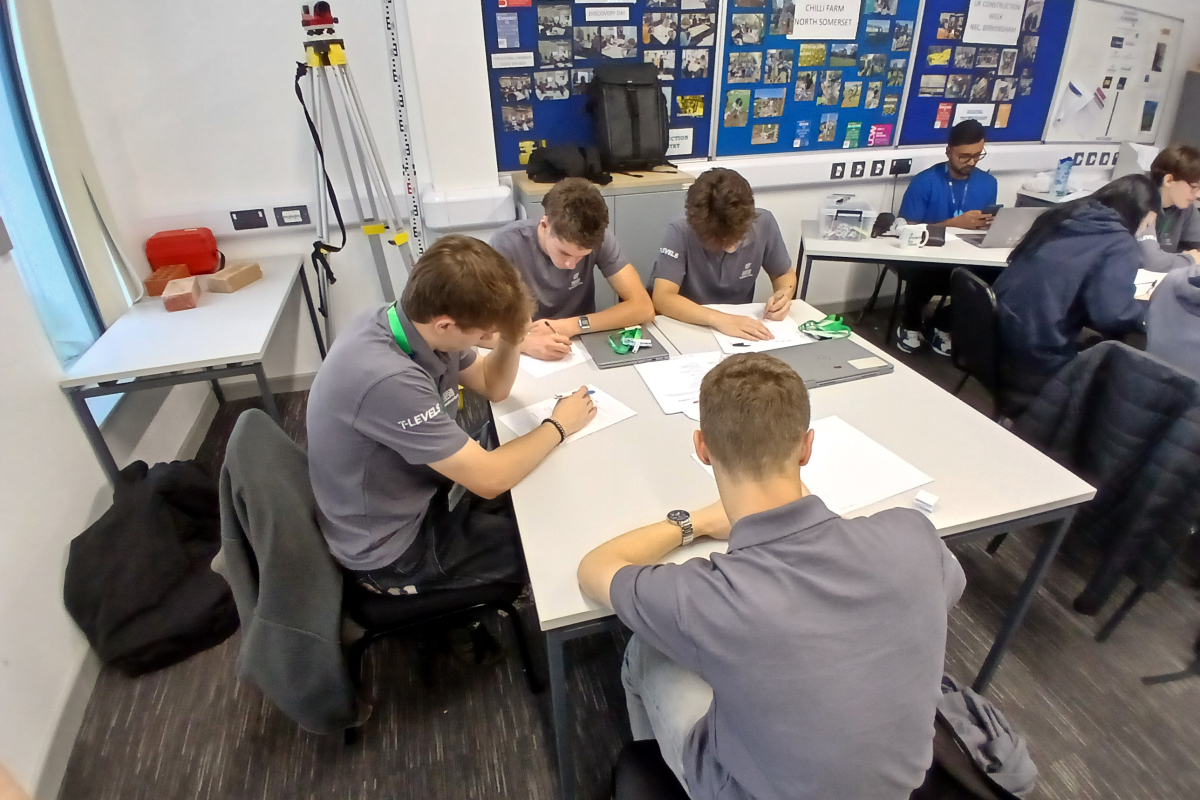 Students sat at tables while writing during CV workshop
