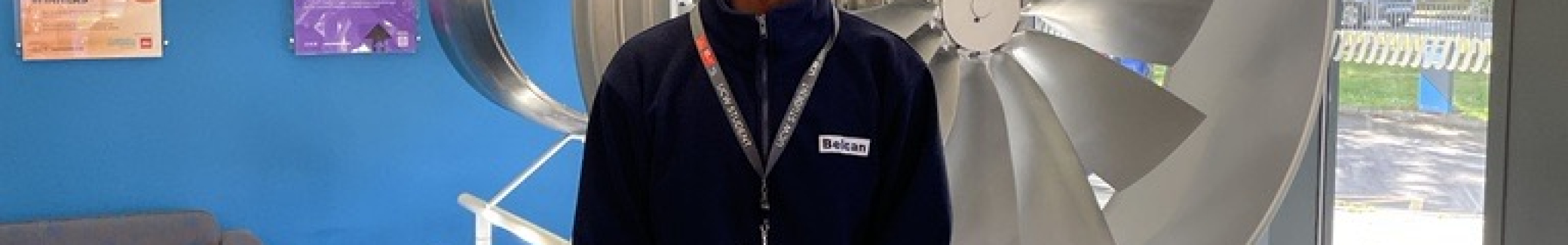 Mustafa in front of wind turbine