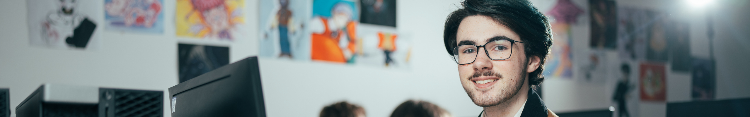 male student on computer