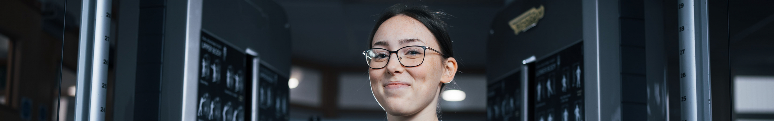 Lily standing with her arms crossed