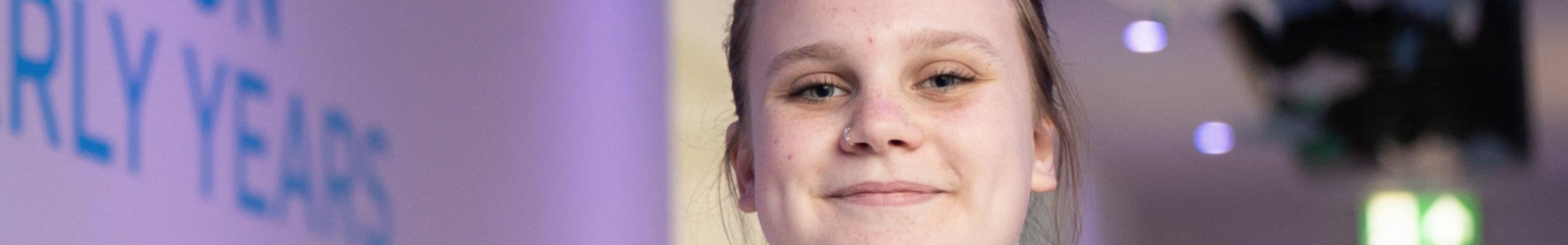 early years student standing in early years corridor