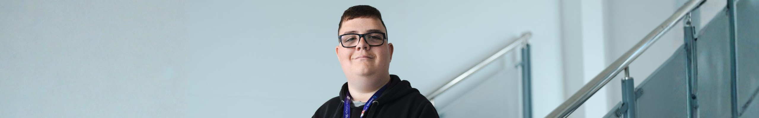 student harry smiling at the camera