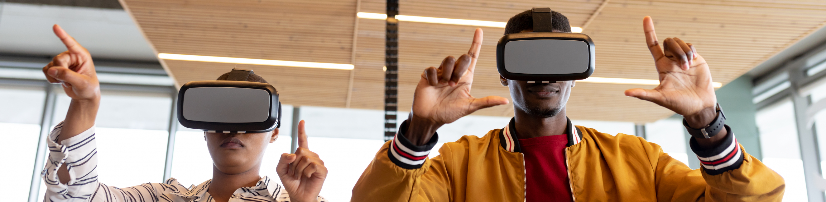 Two learners using virtual reality headsets